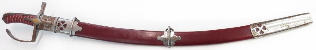 A REPLICA POLISH / HUNGARIAN SABER: Of classic L- guard form, the grip with wire-bound leather wrap, the long, curved blade well wrought. In its wooden scabbard with steel mounts. 20th century. Minor wear. Overall length 99cm. Condition