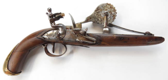 A FLINTLOCK POWDER TESTER: English work, stocked in hardwood with brass furniture, the lock, testing mechanism and spring of steel, with maker’s initials AB on the wheel. Mid-18th century. Well worn. Overall length 29.5cm. Co