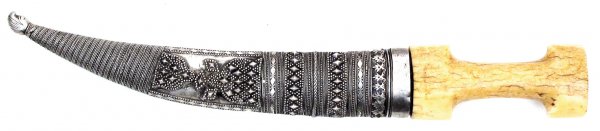 A PERSIAN DAGGER KHANJAR: The grip of typical form, carved of a single large section, the heavy blade lightly curved, double-edged, fullered, and forged of fine Persian black damascus wootz steel with thickened armor-piercing 