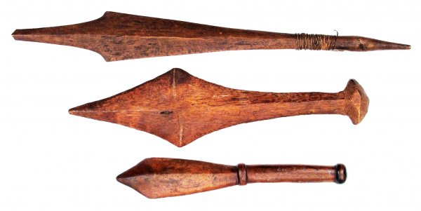 THREE W. POLYNESIAN WAR CLUBS: Fijian or Tongan, all carved from wood, of flared form with central ridge and shaped pommel. Late19th-first half of the 20th century. Overall length of the largest 77 cm. Condition II