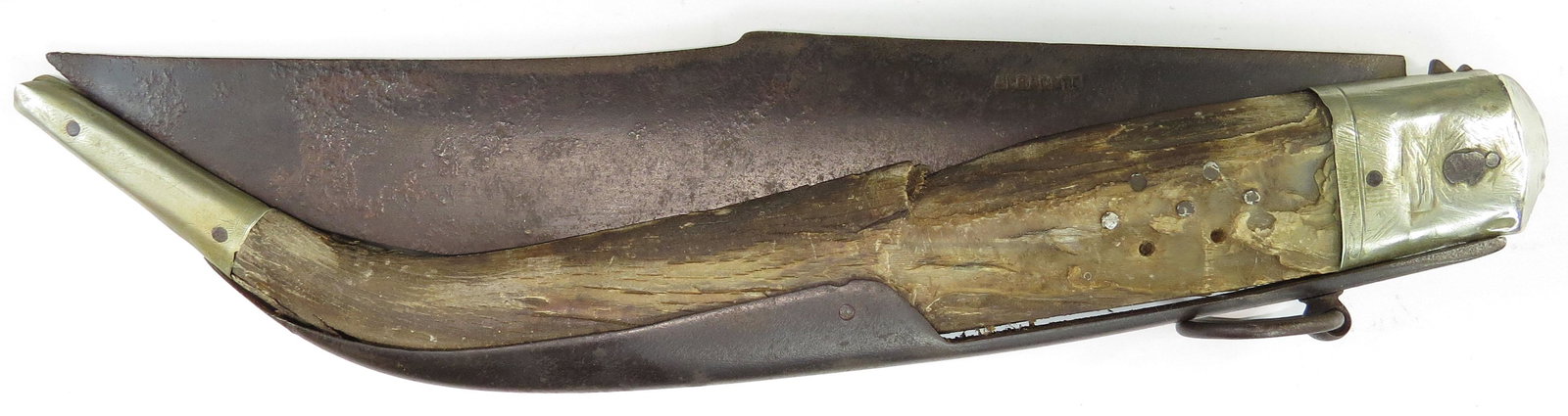 A LARGE NAVAJA CLASP KNIFE: With silver (?) mounts with and panels of horn, the single-edged blade of characteristic form. 19th century. As found. Overall length 50cm. Condition V