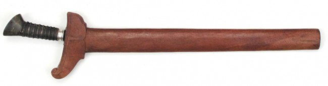 A MORO KRIS SWORD: Five-waved blade with characteristic fretwork and separately applied forte showing clear evidence of herringbone pattern weld to midsection, with pair of silver baca baca. Grip of horn with cord wrap 