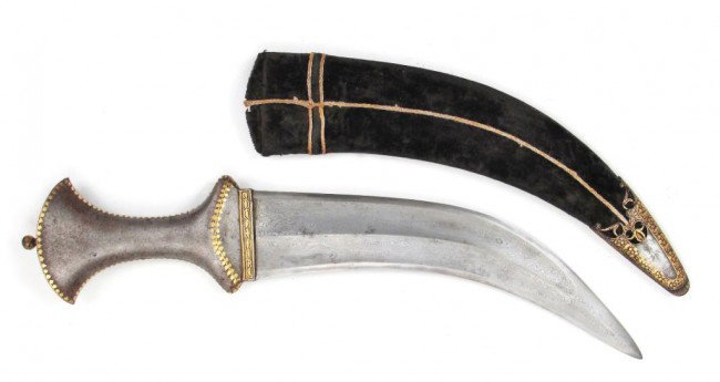 AN INDIAN KHANJAR DAGGER: Of Hyderabad form, forged entirely of finely pattern-welded damascus steel. The hilt with finely inlaid gold borders, the blade lightly curved and double-edged with central edge and thickened tip for 
