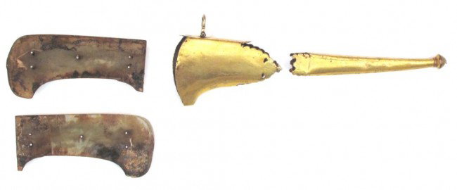 A SET OF MOUNTS FOR A PESH QABZ DAGGER: Mughal work, comprising two grips of characteristic form carved from apple-green jade, and a locket and chape of heavily gilded copper with profiled edges, the locket with hinged toggle intact. Mid-18