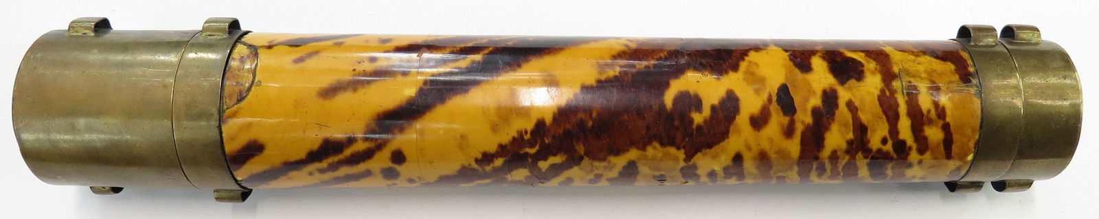 A RARE CHINESE TROUSSE SET: Mid-Qing Dynasty, the wooden case of cannister form, covered entirely in shell, and well-inletted for implements, with brass caps. Comprising a pair of knives with wooden grips and bone pommels, two p