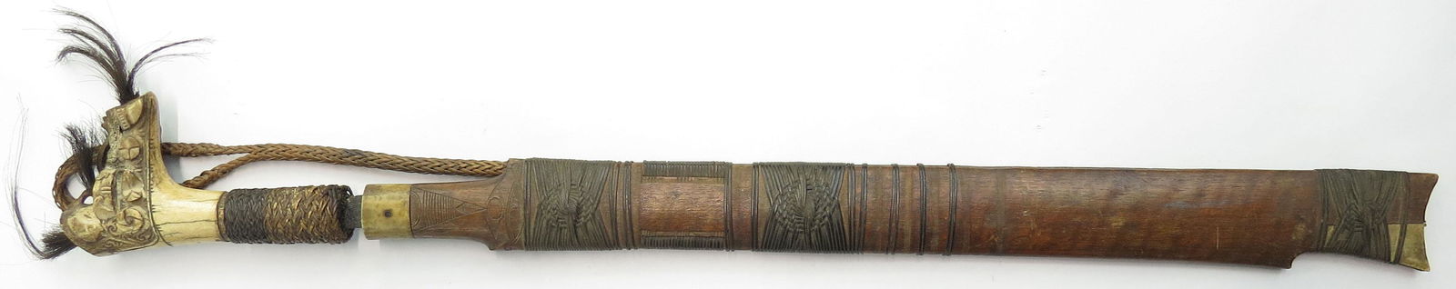 A DAYAK HEADHUNTER MANDAU SWORD (1 of 5)