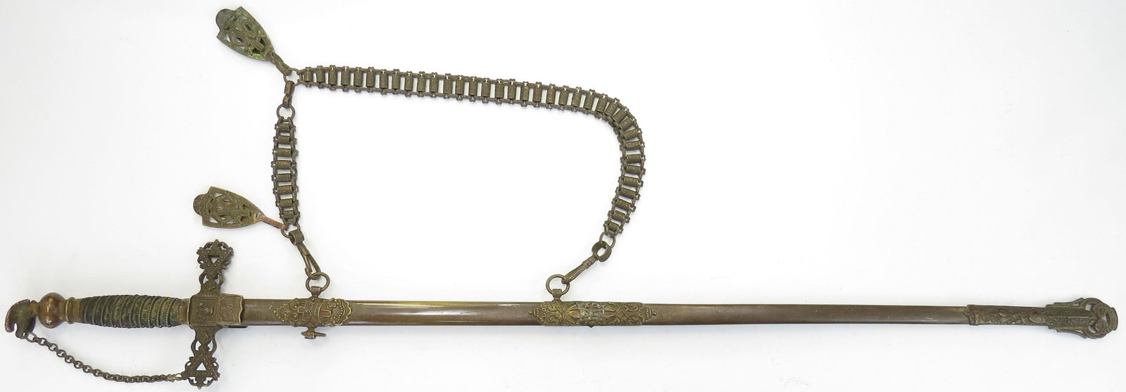 A RARE KNIGHTS OF THE GOLDEN EAGLE SWORD: A very rare type, the fraternal order founded in 1872 and centered primarily in Pennsylvania. The mounts cast in Gothic high relief, the pommel a fully modeled eagle connecting the knuckle chain to th