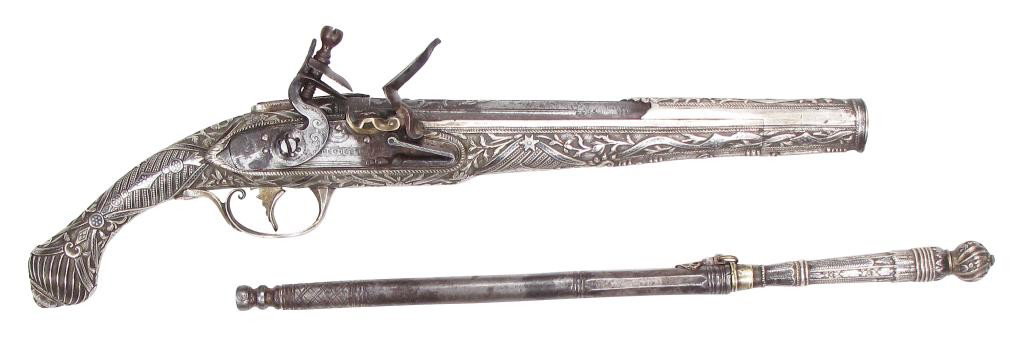 A GREEK KOUMPOURA PISTOL & MATCHING OVELOS RAMROD: Unusually fine workmanship from Epirus, the entire stock of silver, chiseled, engraved and nielloed in intricate baroque motifs involving garlands and floral sprays and the Byzantine double-headed eag