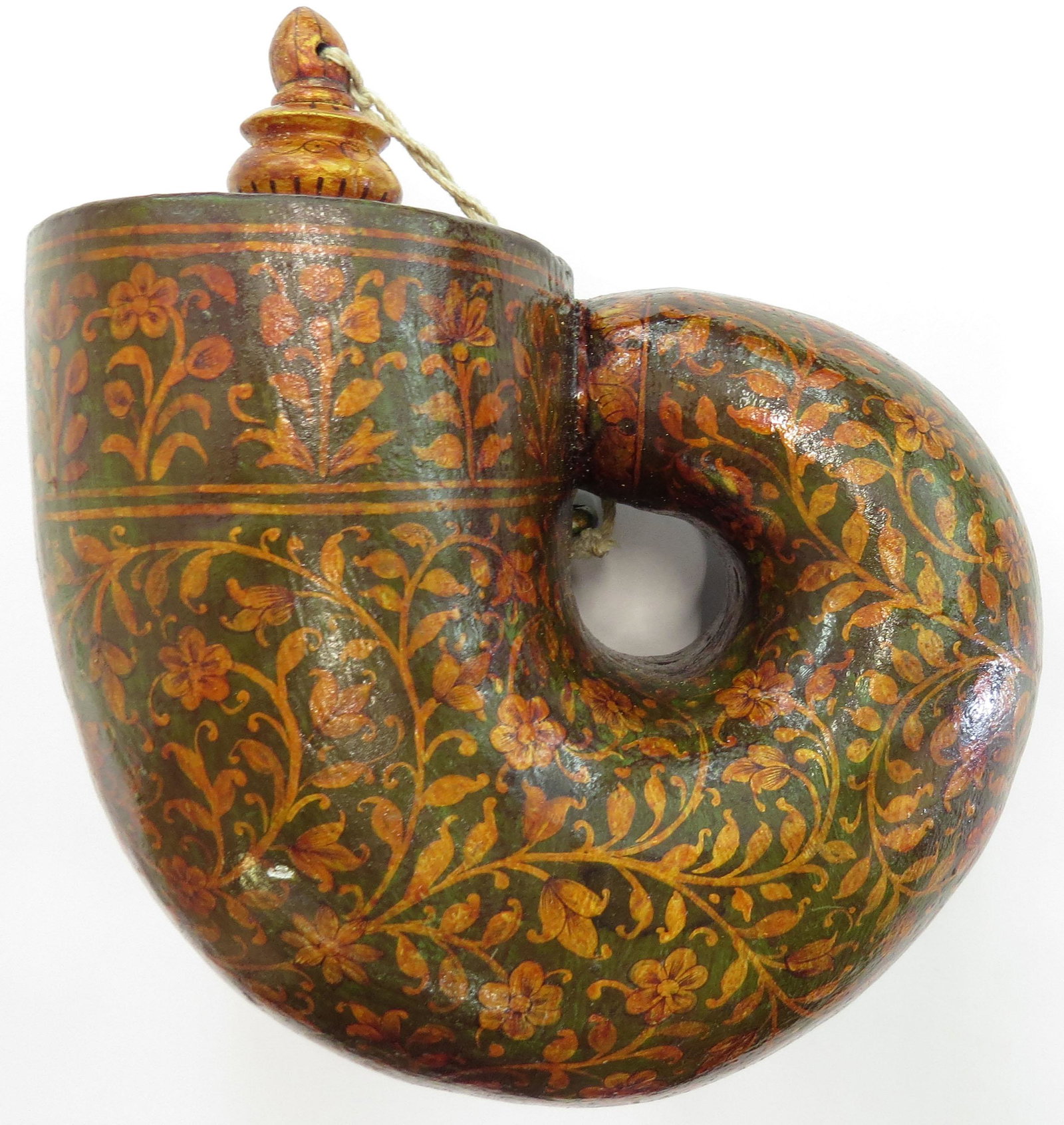AN INDIAN BARUTDAN POWDERHORN: Mughal work, the wooden body superbly lacquered in intricate flowering vinework, gold on a dark ground with geometrical borders. Mid-18th century. Minor wear. Overall height 22cm. Condition II