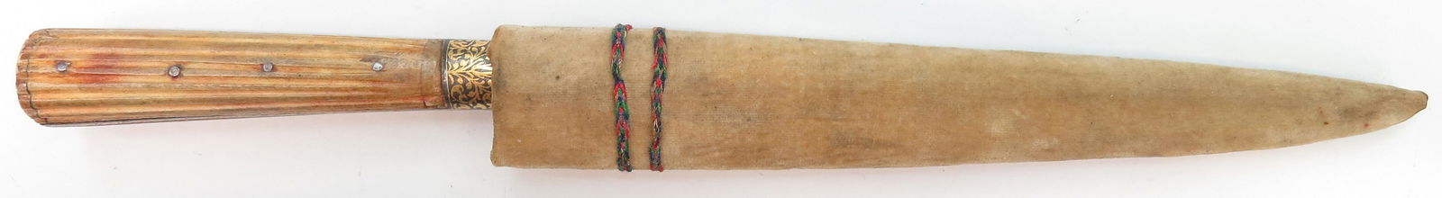 AN INDIAN KARD DAGGER: A robust example with finely reeded bone grip, the bolsters elaborately inlaid with gold, the blade wrought of actively-grained black wootz. In its velvet-covered wooden scabbard. 19th century. Overal