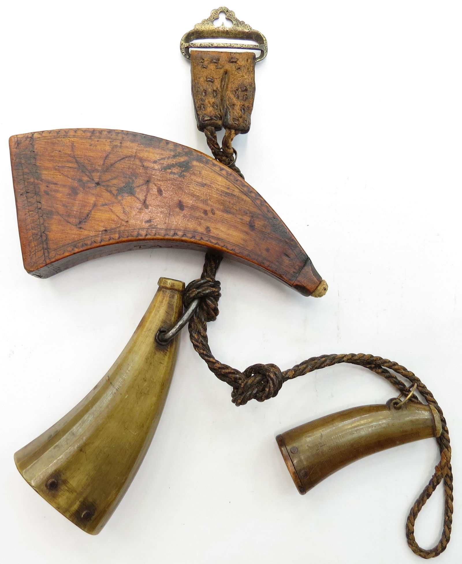 A RARE SET OF SCOTTISH POWDERHORNS & FLASKS: The first of wood, with typical chip-carved borders and central pinwheel motif, the second of horn with faceting bearing a monogramed cap and dated 91 for 1791, the third a scoop, likewise carved of h