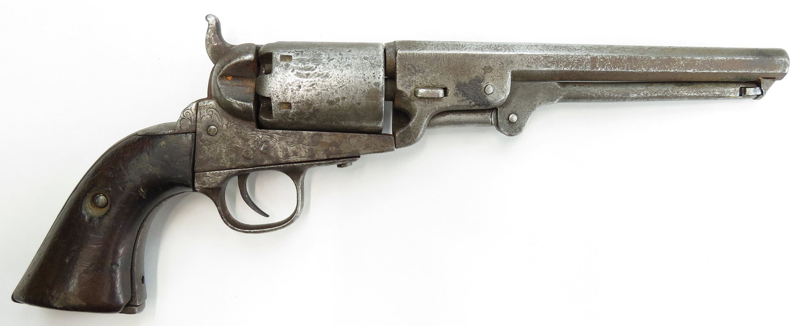 A COLT MODEL 1851 BLACK POWDER REVOLVER: With wooden grips and engraved frame and barrel, well-worn name on barrel. 36 cal. Action functions. C. 1851. Overall length 36cm. As found. CONDITION V