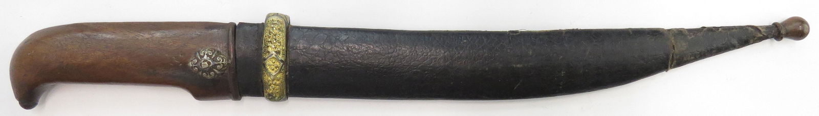 A RARE CAUCASIAN BEBUT DAGGER: The hardwood grip similar to that of a shashka with nielloed silver boss, the heavy blade lightly curved and fullered. In its leather-covered wooden scabbard with filigreed suspension band. 19th centu