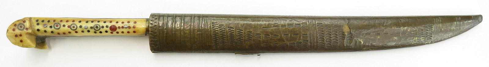 A BOSNIAN DAGGER: The eared grips of bone. Broad, single-edged blade. Sheath of wood covered in brass with incised lines. 19th century. Overall length 39 cm. Condition II