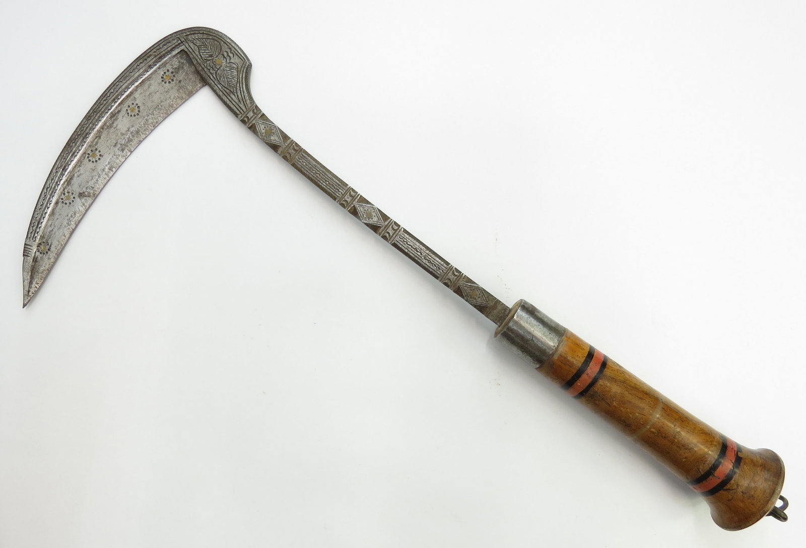 AN AFGHAN LOHAR WAR PICK: An earlier example with fixed blade, the robust head and haft forged of steel with brass inlay to the obverse and turned wooden grip. Mid- 19th century. Light wear overall. Such picks were used agains