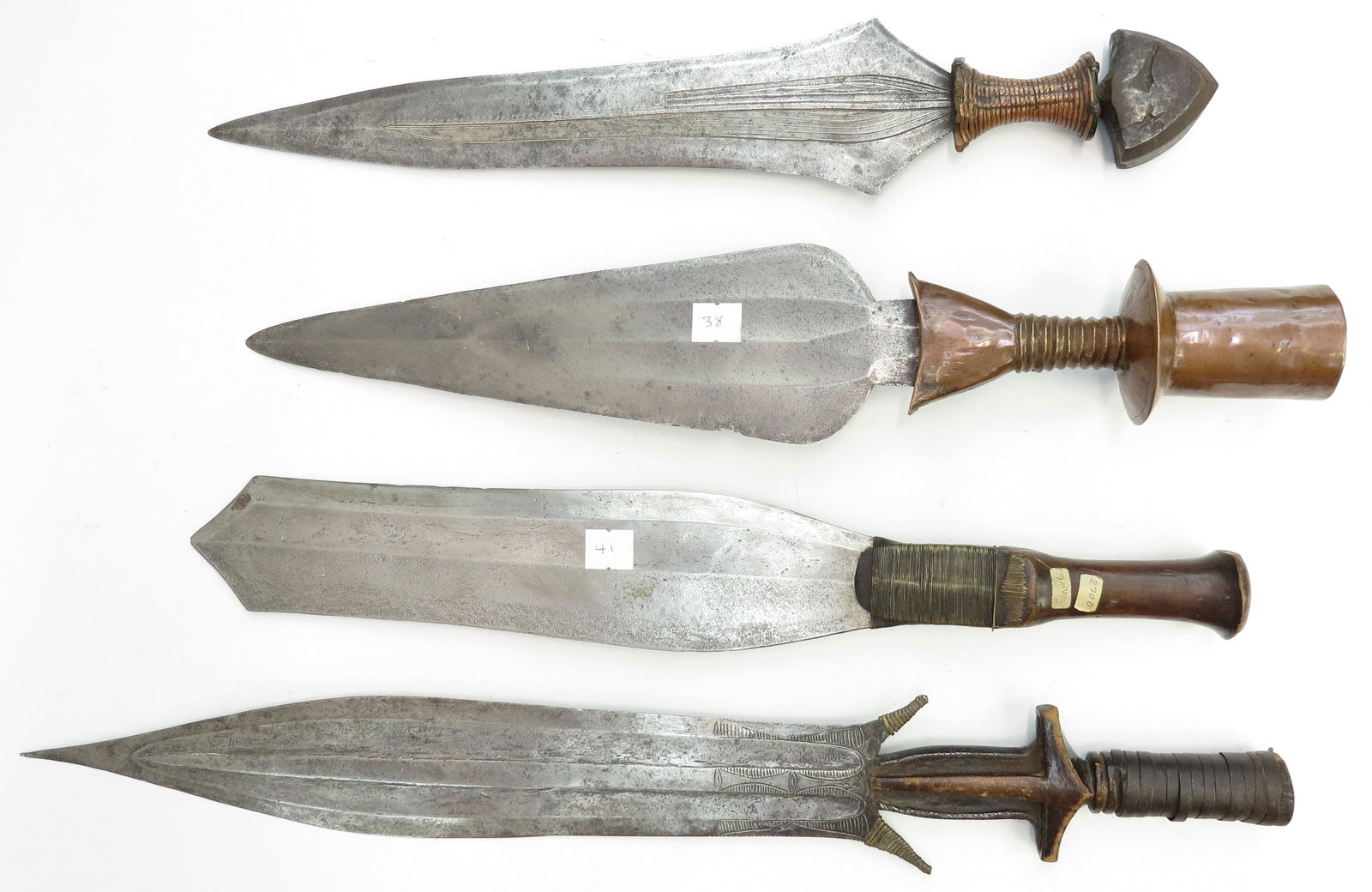 FOUR RARE CENTRAL AFRICAN SWORDS: Comprising the following: a Lockele/Topoke short sword called an Ampute.A Fang short sword called a Fa. Another, likely Fang also of rare form, and a Sakashort sword from the Mongo people. All ex-Max