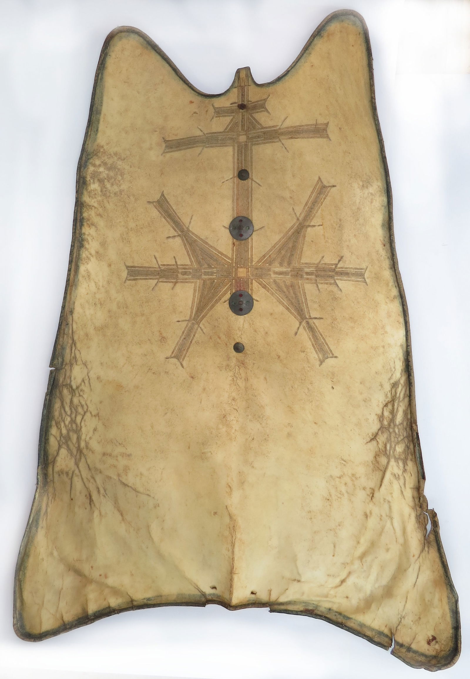 A VERY RARE TUAREG AYAR SHIELD: A very rare example of characteristic form, made from oryx hide with complex and intricately incised talismanic lineal motifs retaining some original pigment, these may also emulate tribal tattoos. Wi