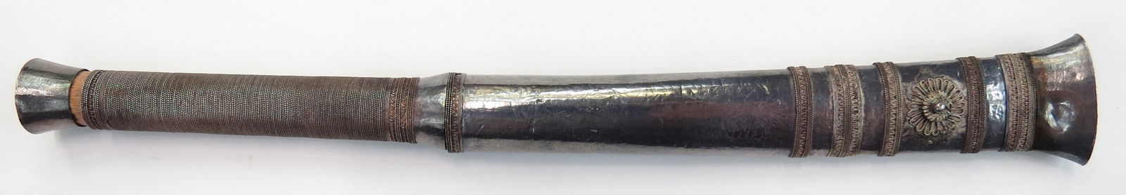 A BURMESE DHA DAGGER: Mounted entirely in silver, with well-wrought, single-edged blade. 19th century. Worn. Overall length 19.4 cm / 7 3/4". Condition III