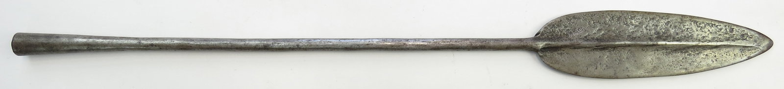 AN AFRICAN SPEARHEAD: Tuareg work, well wrought of steel with central rib and long socket. 20th century. Overall length of the longest 56.5 cm / 22 1/4". Well worn. Condition III