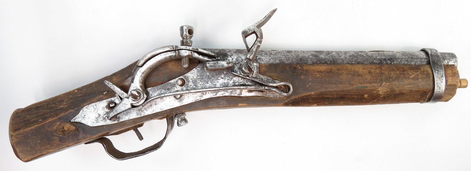 A RARE NORDIC SNAPLOCK PISTOL: An extremely scarce example, the form preserved for centuries in Scandinavia and Imperial Russian hinterlands, the archaic wooden stock with faceted butt, the characteristic lock, showing a variety of