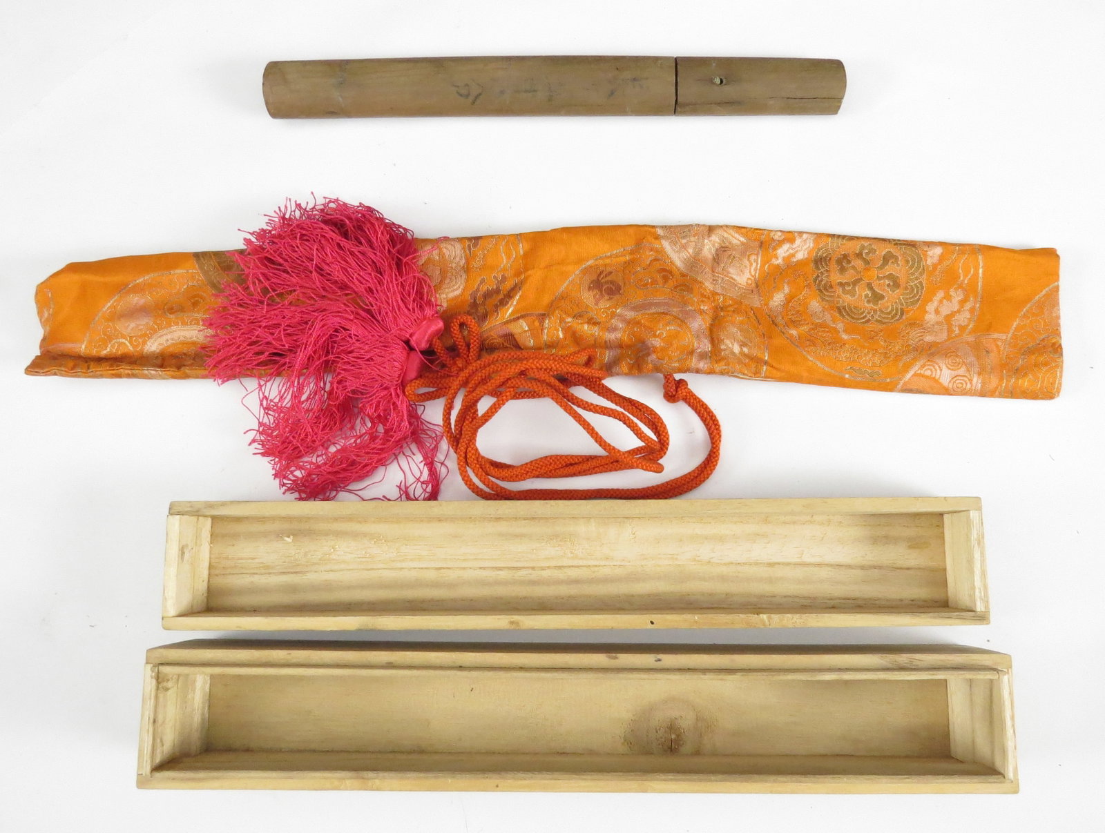 A JAPANESE SAMURAI TANTO SWORD: In old shirasaya with worn sayagaki which appears to read HOKI SABURO KUNIMUNE (possibly Bizen Saburo) together with the nagasa. With brass habaki. The blade with straight temperline and visible turnb
