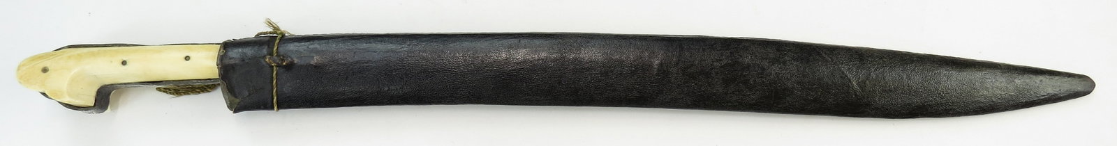 AN OTTOMAN YATAGHAN SWORD: An early example, indicated by the karabela-form grips. The silver tangband, ferrule and reinforces, all of silver, engraved and nielloed. The blade likewise characteristic for the period, quite broad