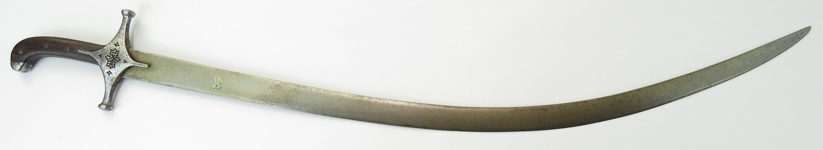 A PERSIAN SHAMSHIR SWORD: With hardwood grips steel pommel, the guard intricately pierced in Persian geometrical motifs. The long, single-edged blade of lenticular cross-section and lightly curved, forged of the fine and rare 