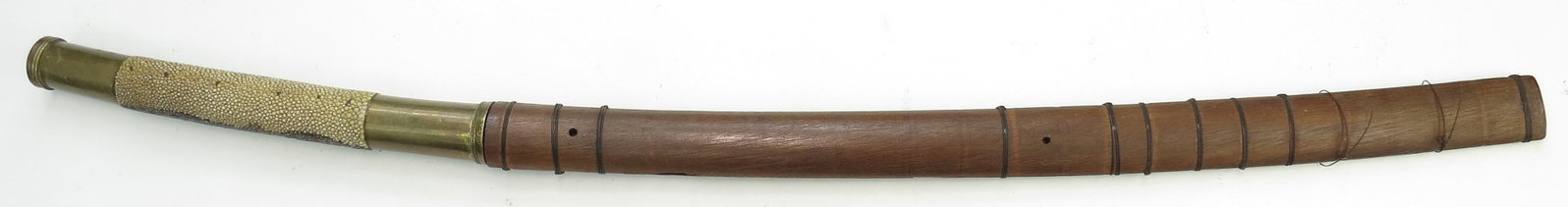 A BURMESE DHA SWORD: With robust brass mounts and rayskin grip, well-wrought, curved, single-edged blade with radiused tip retaining much original sharpness. In its teakwood scabbard with rare elephant hair bindings. Brou