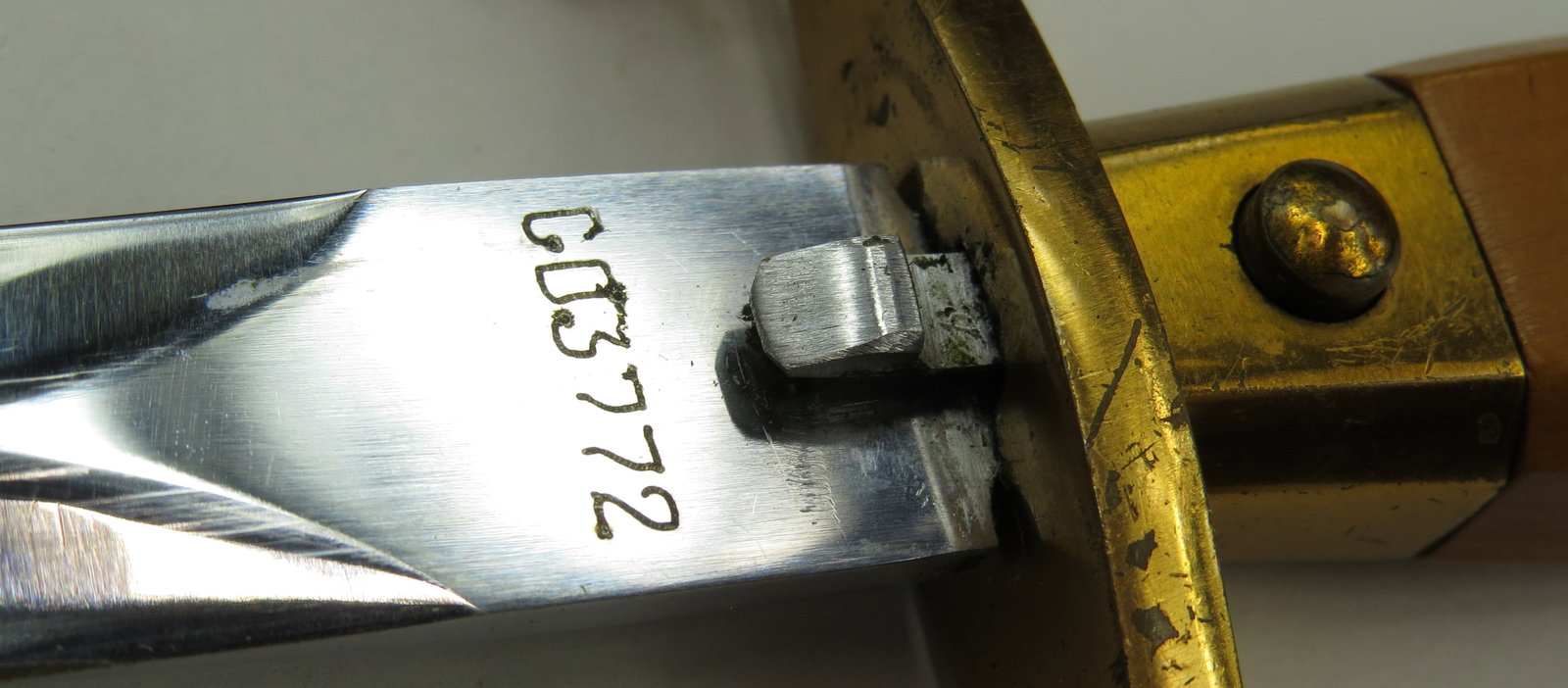 A SOVIET ARMY DAGGER: Of characteristic form, brass mounted and retained its scabbard. Dated (19)57. Overall length 34.4cm / 13 ? inches. Condition II