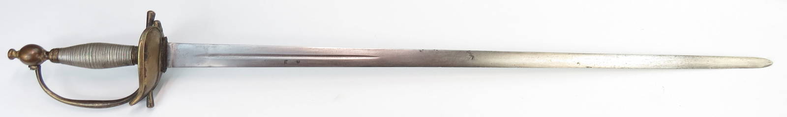 A BRITISH M1796 INFANTRY OFFICERS SWORD: Characteristic brass hilt with robust modelling, the grip wrapped with silver wire. The long blade straight and double-edged, with a short central fuller to either side. Late 18th-early 19th century.