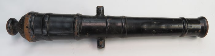 A MASSIVE IRON NAVAL CANNON