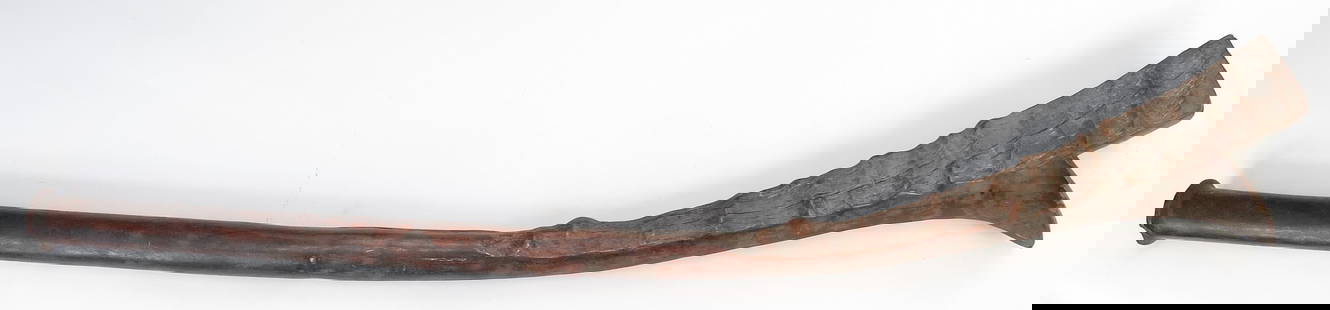 A RARE FIJIAN GATA WARCLUB: A fighting club of great size and weight, carved of a large, actively-grained hardwood limb. The characteristic expanded head deeply notched, with a short crest at the tip. Excellent glossy patina. 19