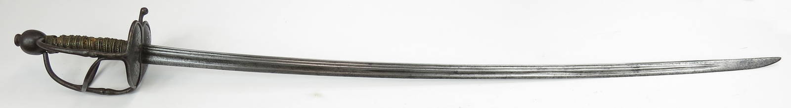 A CONTINENTAL WALLOON SWORD: German or Dutch, with well-wrought steel hilt of characteristic form with spherical pommel and pierced shell guards. Grip retains original brass wire wrap. The long, elegant saber blade finely fullere
