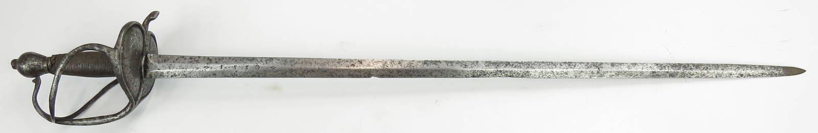 A CONTINENTAL WALLOON SWORD: Flemish, with well-wrought steel hilt of characteristic form with spherical pommel and solid shell guards. Grip retains original steel wire wrap and turkshead knots. Mounted with a fine gently-taperin