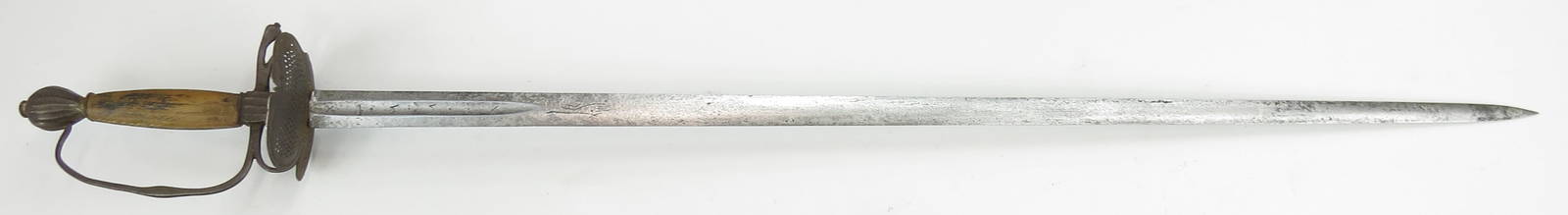 A RARE TRANSITIONAL RAPIER: Likely Germanic, the robust steel hilt with pierced shell guard and fluted ecusson and pommel with wooden grip. Mounted with a fine heirloom blade dated 1551 at the forte in a short fuller between a p