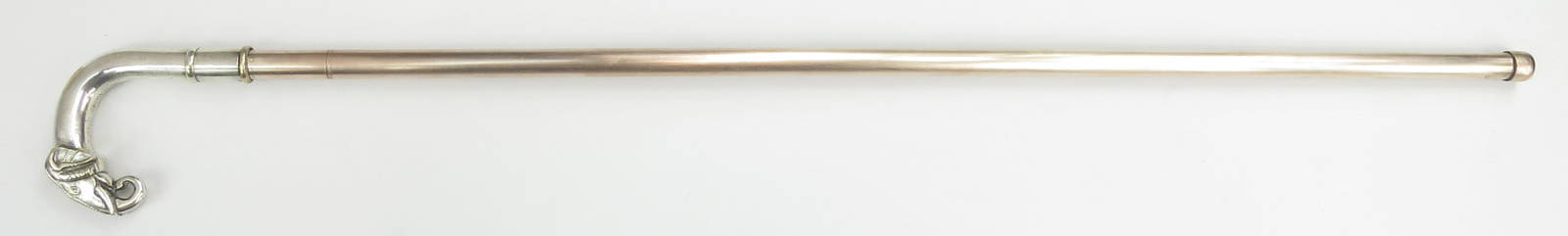 A RARE INDIAN SWORDCANE: Northern Indian work, the silvered hilt with pommel in the form of a fully-modelled elephant head with rotating ferrule to lock the shaft. The straight, single-edged blade with gold inlaid vinework pa