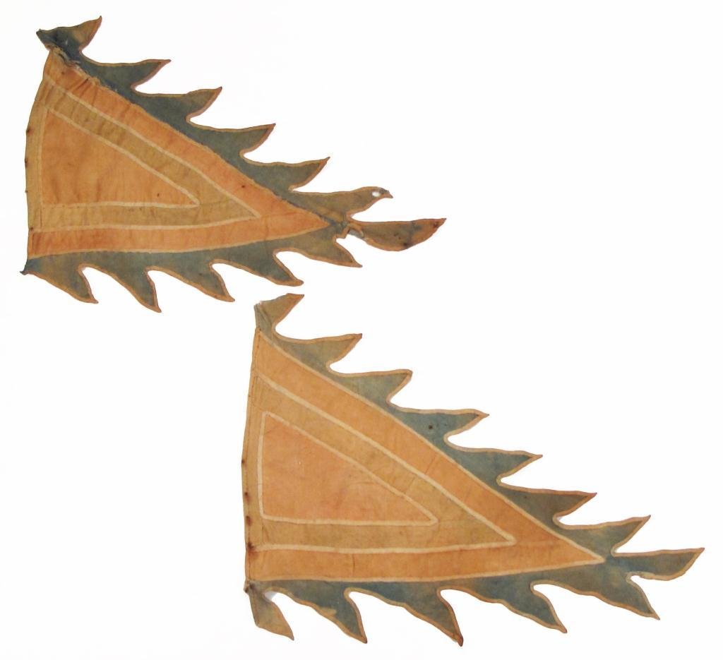 A PAIR OF CHINESE QING DYNASTY CAVALRY BANNERS: Each sewn of handwoven cotton cloth, the field red with a brown triangle piped in cream, and a dramatic flaming border of blue with pale brown borders. Mid-19th century. Wear and fading. Overall lengt