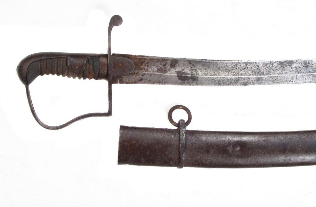 A BRITISH M1796 LIGHT CAVALRY SABER: Of characteristic form with steel stirrup hilt and ribbed wooden grip, the broad, curved, single-edged blade with hatchet tip and central fuller.Retains its regulation steel scabbard.Beginning of the