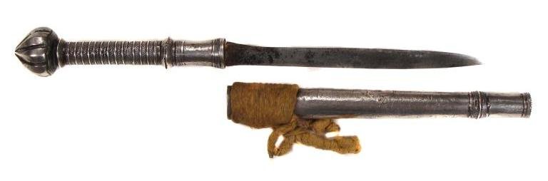 A BURMESE DHA DAGGER: Mounted entirely in silver, the large pommel of faceted lotus-bud form. Grip and scabbard with bands of filigree, the woven shoulder cord partially intact. Single-edged blade.Mid-19th century. Light w