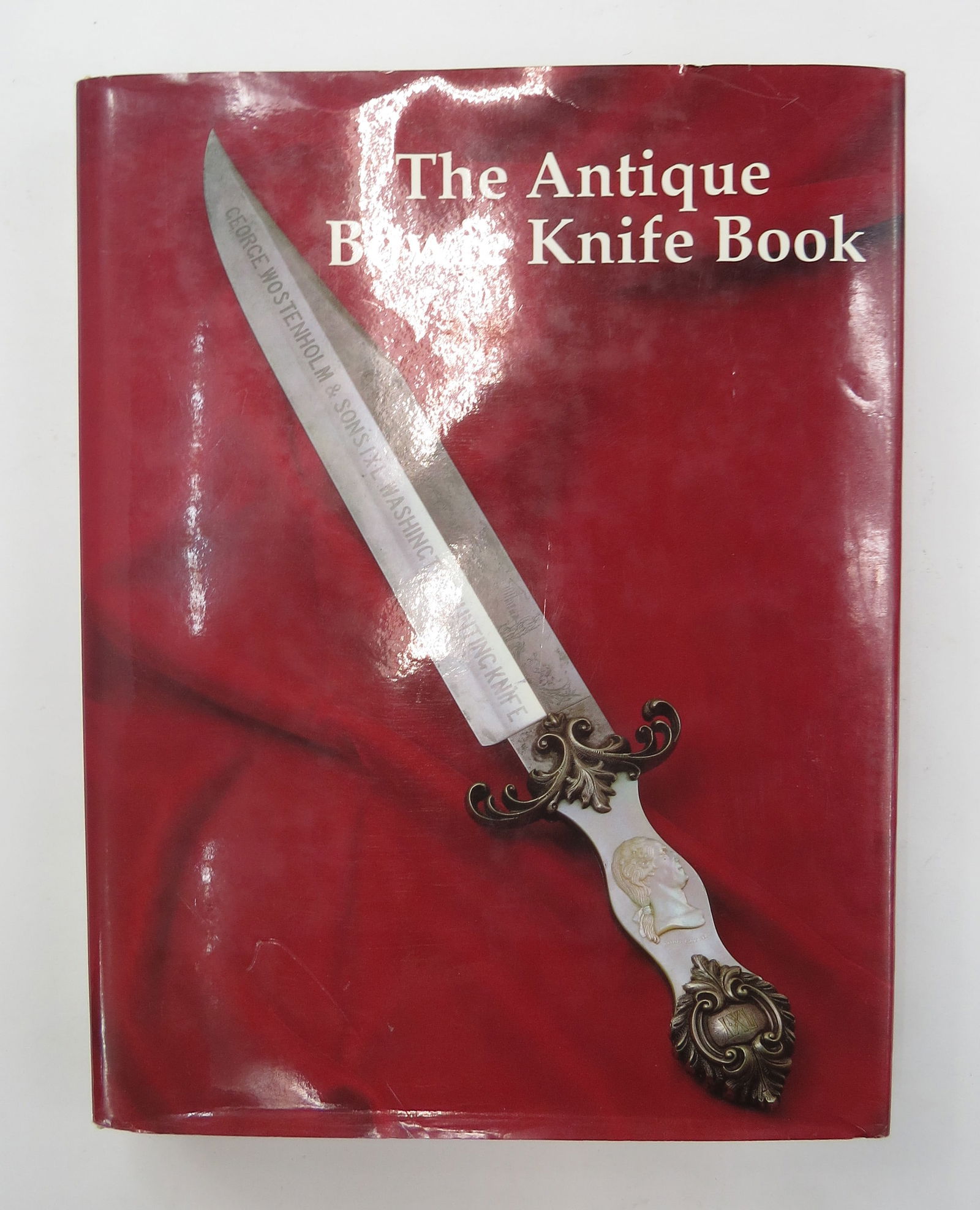 THE ANTIQUE BOWIE KNIFE BOOK LIMITED EDITION: The definitive work on the iconic Bowie knife, Bill Adams, J Bruce Voyles, Terry Moss, authors, Conyers, GA: Museum Publishing Company, Inc. Superior photos, original dust jacket. 1990. Limited 1st ed