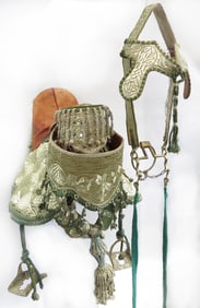 A RARE SET OF MOROCCAN HORSE SADDLE AND TRAPPINGS
