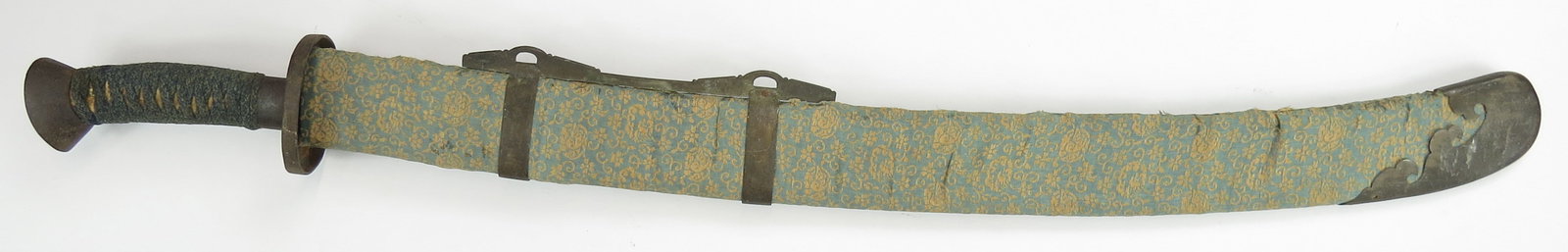 A CHINESE NUWEIDAO SABER SWORD: Qing Dynasty, the characteristic hilt with iron horses hoof pommel and ferrule and round guard with raised border, with intricate woven grip wrap. The well-forged, fullered blade with expanded tip, an