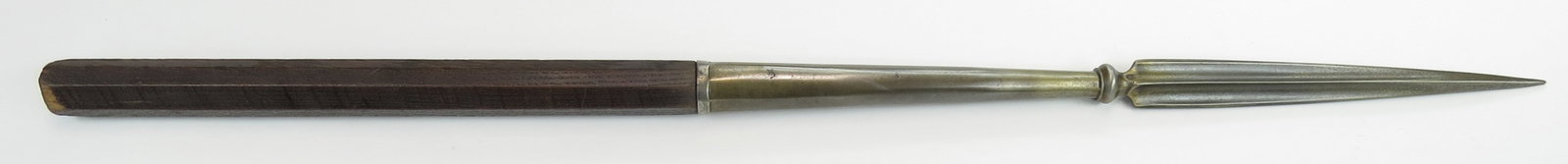 A PERSIAN SINAN SPEAR: Wrought entirely of wootz steel clearly visible on the socket, with heavy, fullered blade and faceted socket. Retains a short section of the octagonal oak haft. 18th century. Overall length 78.8cm./30