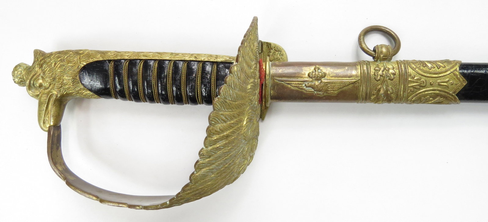 A M1923 ITALIAN AIRFORCE OFFICERS DRESS SWORD: With gilt guard and etched straight blade. In its scabbard with en suite mounts. 20th century. 86 cm, 33 and 36/64 Condition II