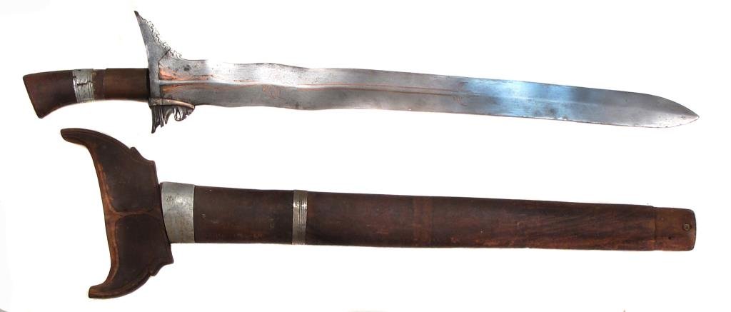 A MORO KRIS SWORD: With wavy blade and copper inlay.Early 20th century.Overall length 71 cm. Condition II