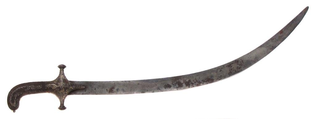 A MUGHAL BOY?S SHAMSHIR SWORD: With sheet silver overlay to hilt, blade shows traces of wootz Damascus forging. Latter 18th century.Considerable wear.Overall length 66.8 cm. Condition IV