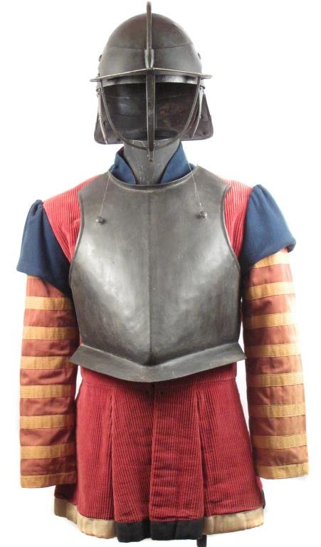 AN ENGLISH CIVIL WAR CUIRASSIER?S ARMOR: Comprising a typical English helmet with movable three-bar faceguard and peak struck with an A armorer?s mark, earguards, and articulated ?lobstertail? neckguard, and a heavy breastplate with rolled c