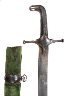 A PERSIAN QAJAR DYNASTY SHAMSHIR SWORD: With octagonal grips covered in black shagreen leather, steel pommel and guard of characteristic form. The massive blade of considerable curvature, forged of highly-contrasted black wootz steel and in