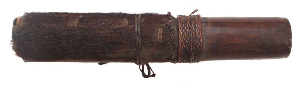 A NAGA DART QUIVER: The body formed of a section of bamboo with rattan bands, covered in fur retained by a series of pegs, and closed with a well-fitted bamboo cap. Worn. Mid-19th century. Overall length 42 cm. _x000D_ C