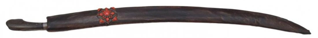 AN AFGHAN SABER: A rare type, displaying design characteristics derived from both Central Asian sabers and the Cossack shashka, with wooden grips and steel bolster, the heavy, single-edged blade with broad central ful